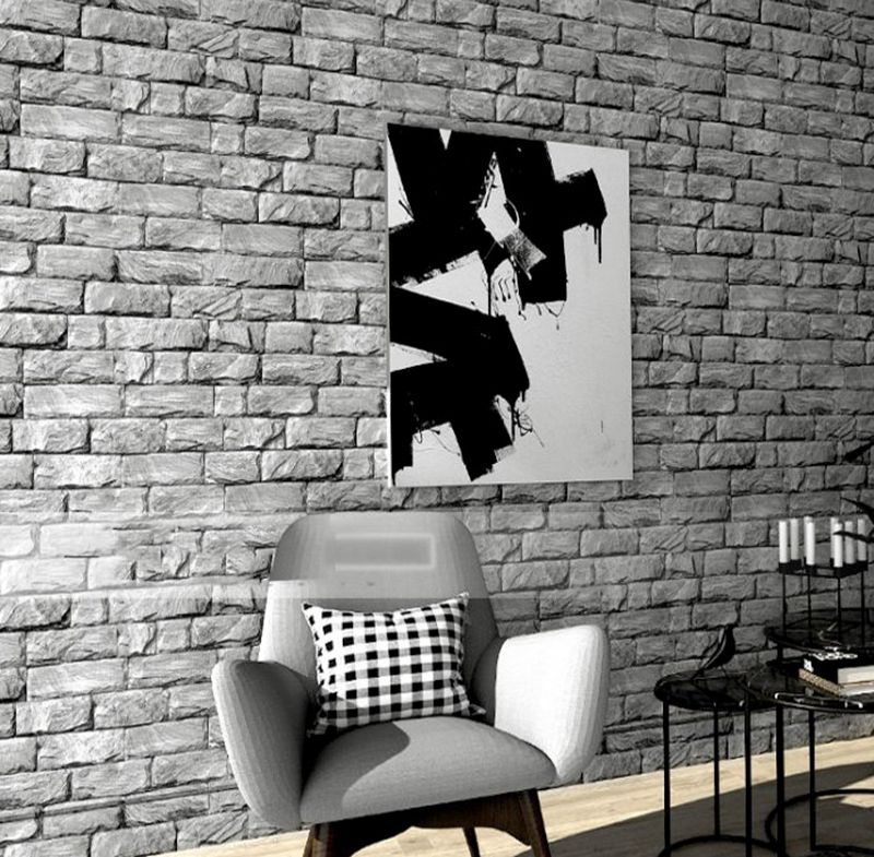 Giấy dán tường vân đá màu xám khiến căn phòng trở nên sang trọng hơn